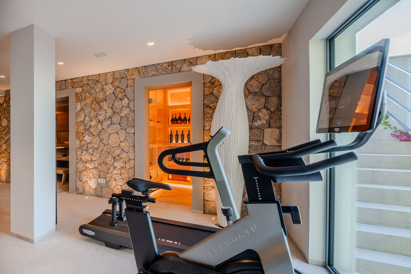 Fitness room with floor-to-ceiling sea view