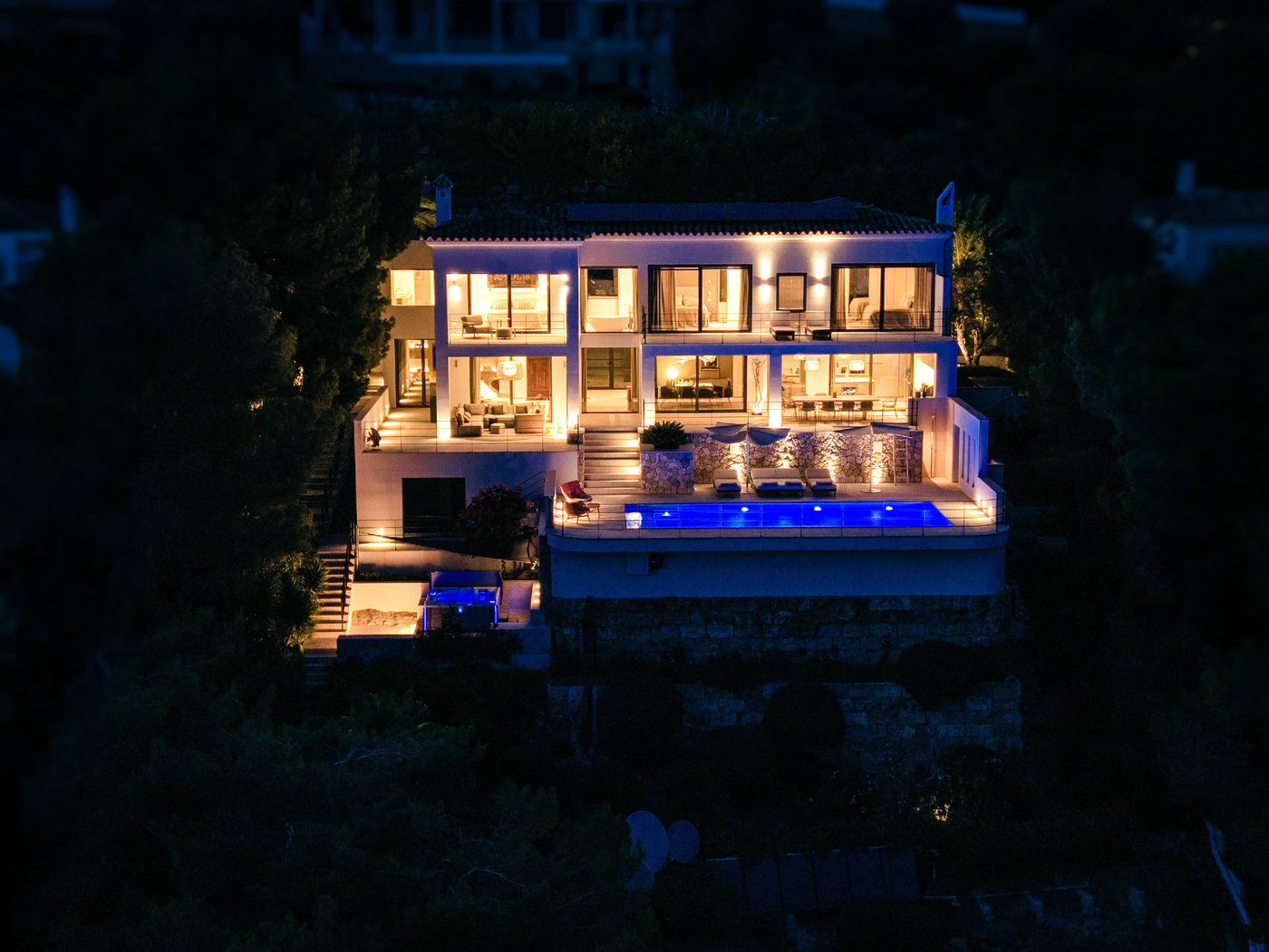 Villa Monport illuminated at blue hour above Port d'Andratx
