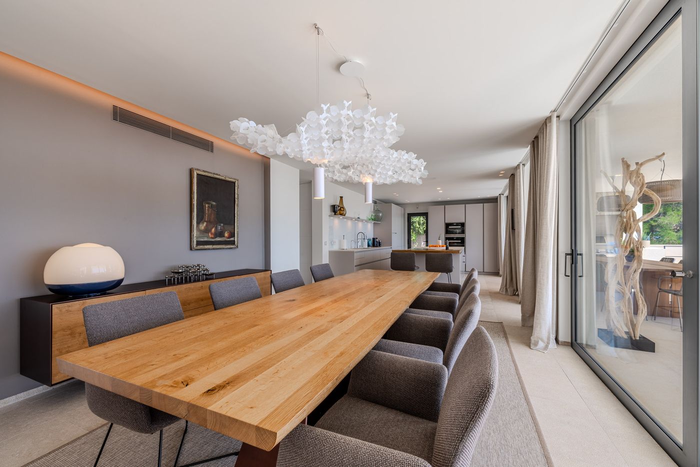 Open-plan living and dining opening to the sea-view terrace