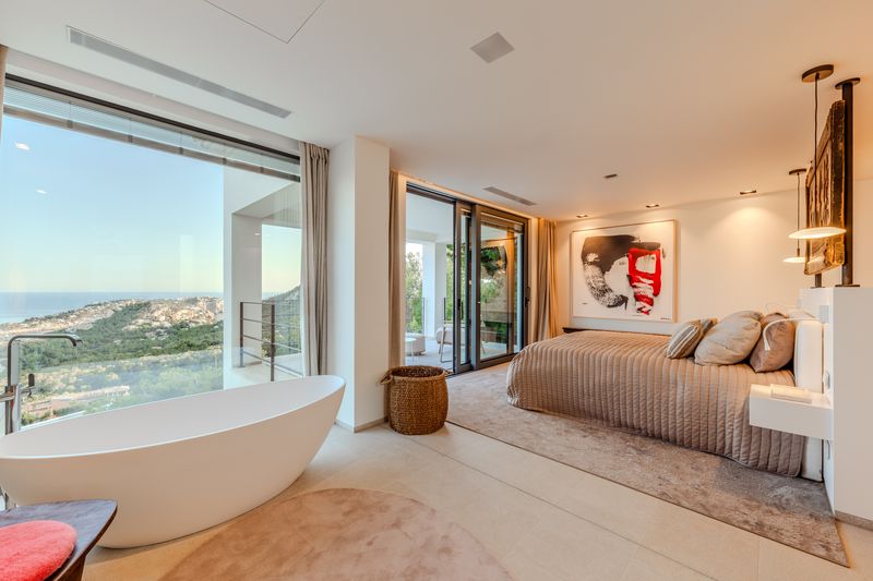 Master suite with a free-standing bath and panoramic sea view