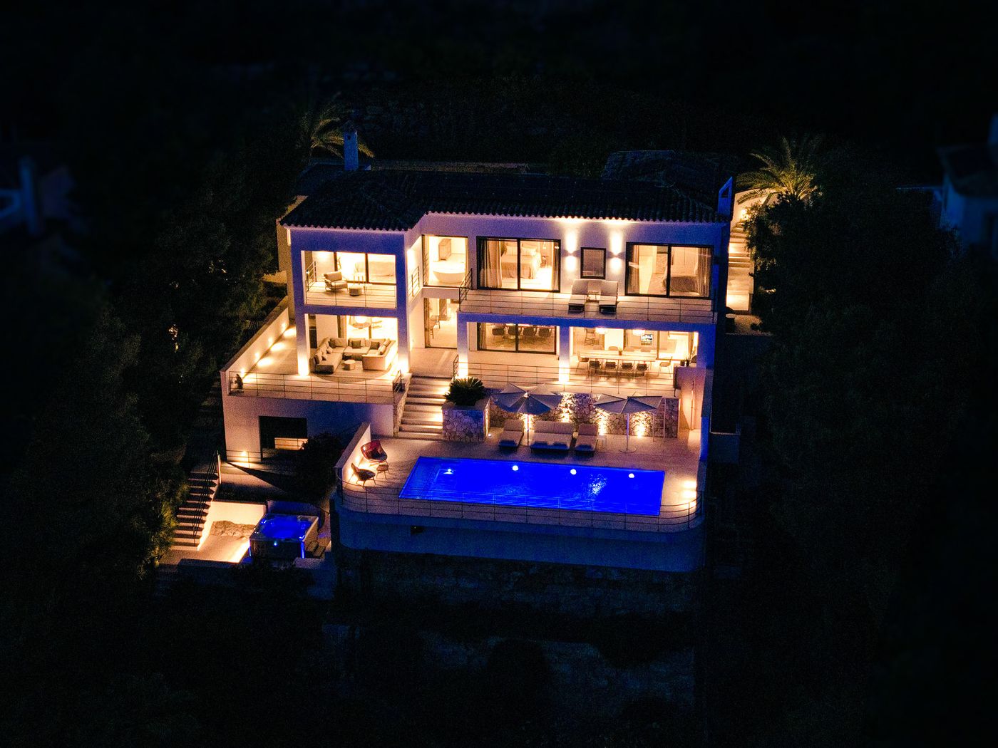 Villa Monport glowing at dusk — every system engineered to the last detail