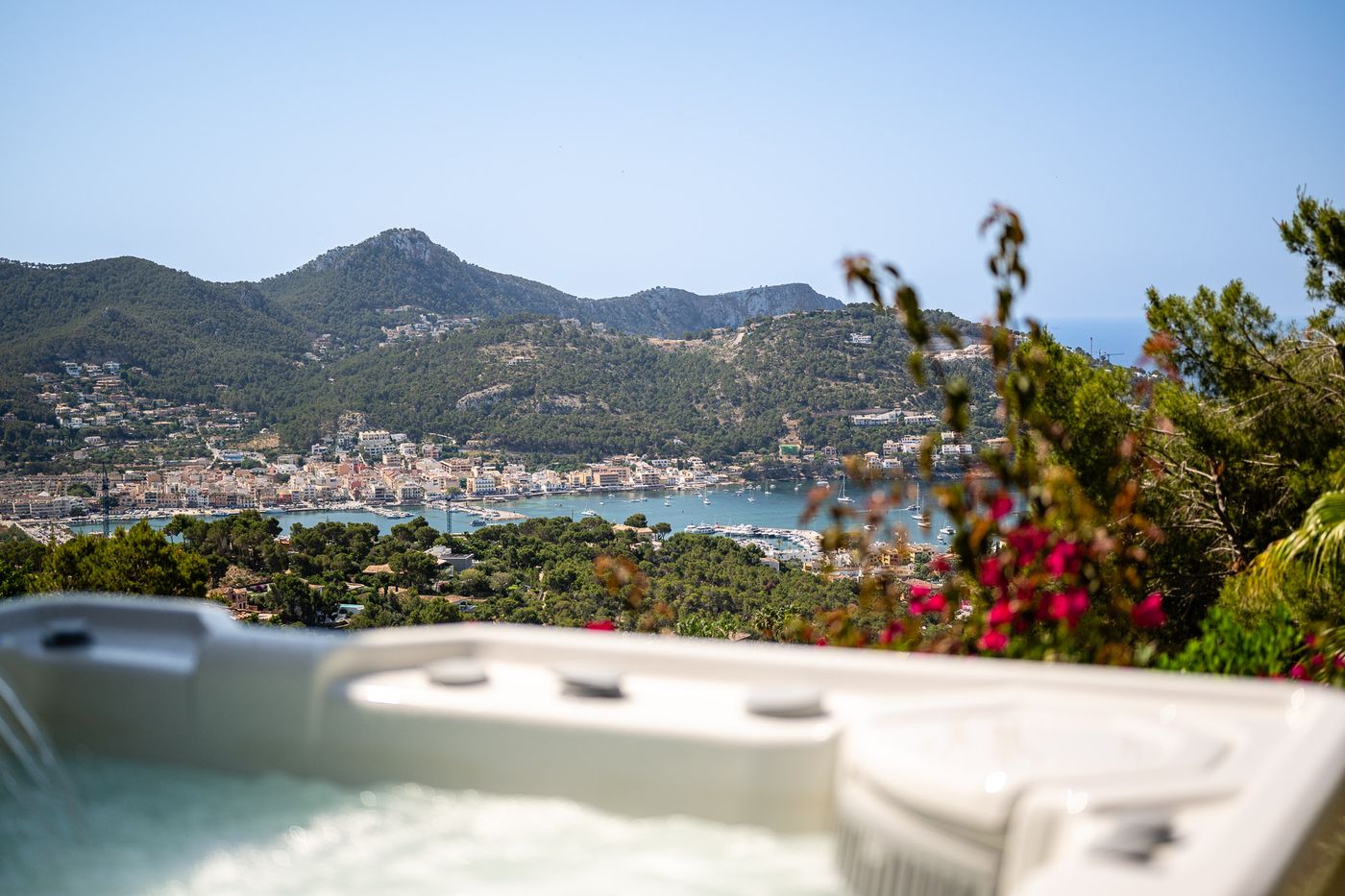 HotSpring whirlpool on the pool level, the bay and harbour of Port d'Andratx beyond